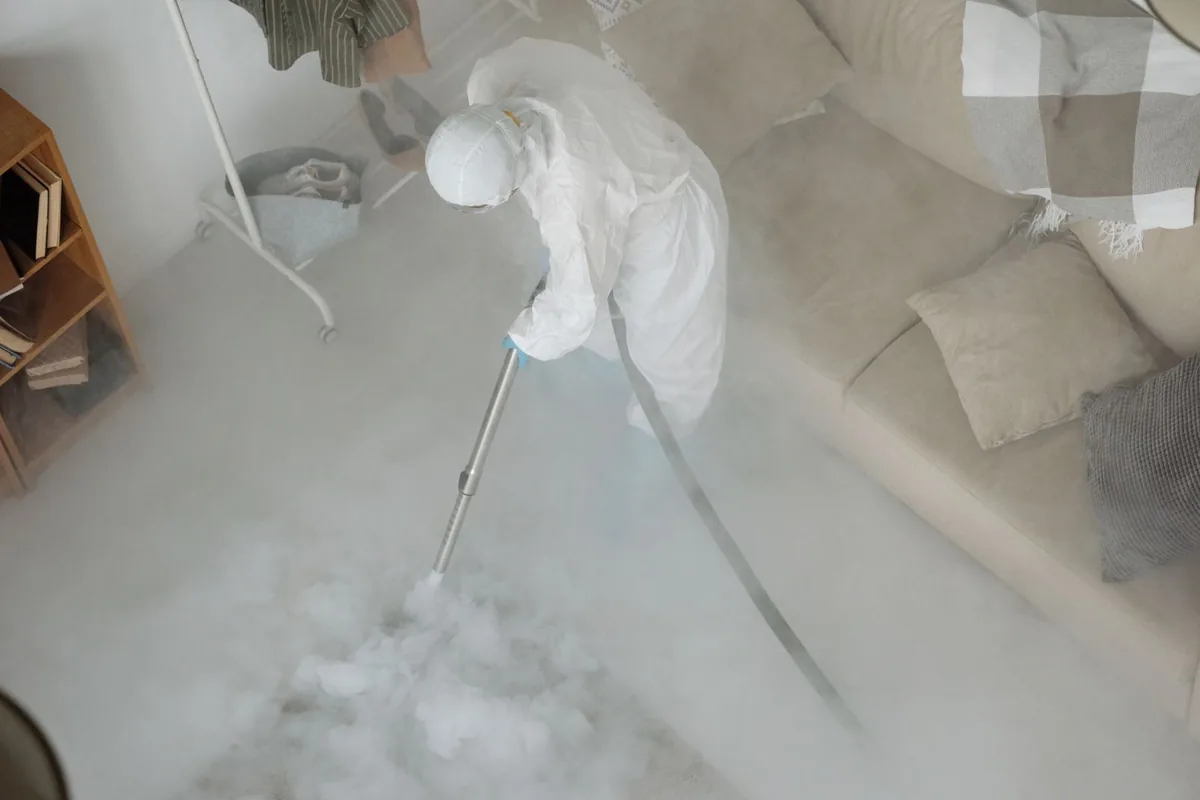 Biohazard cleanup technician in protective equipment, Antioch, CA
